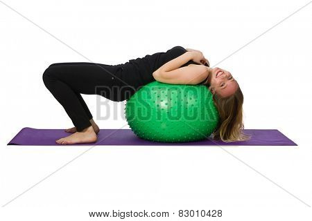 Young woman exercising with swiss ball