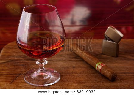 alcohol and cigar on a wooden table