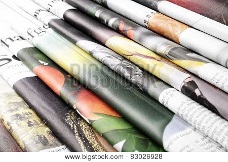 Pile of folded newspapers