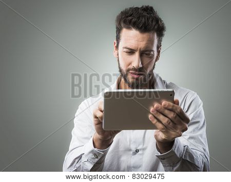 Attractive Man Using Tablet