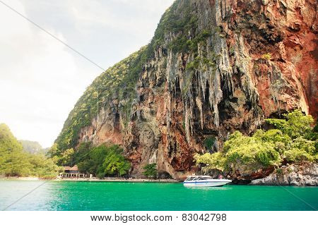 Cliffy Island In Azure Sea Water