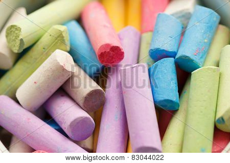Colorful crayons for drawing on the pavement close-up