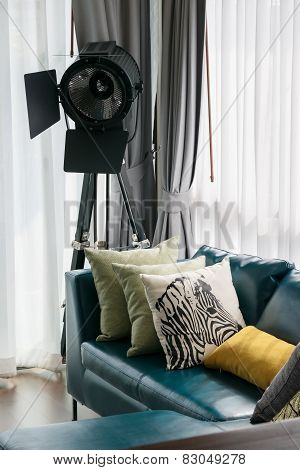 Modern Living Room With Green Sofa And Pillows At Home