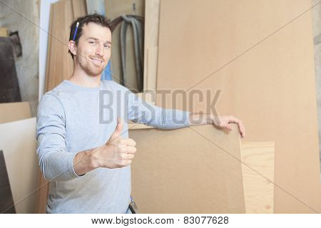 A carpenter working hard at the worksop