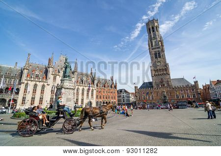 Bruges, Belgium - May 11, 2015: Tourist On Grote Markt Square In Bruges.