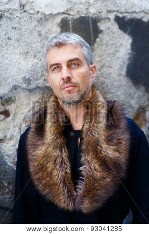 Portrait Of A Sexy Man In Wolf  Fur And Thoughtful Expression On His Face, A  Structure Wall On Back