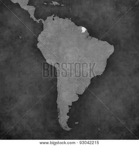 French Guiana on the map of South America. The map is in vintage black and white style. The map has soft grunge and retro old paper atmosphere.