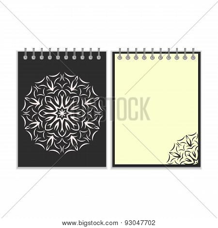 Black cover notebook with round florwer pattern