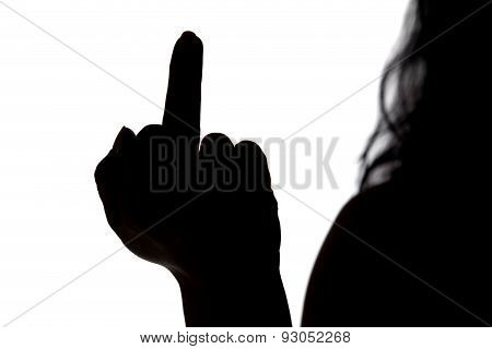 Silhouette of woman showing middle finger