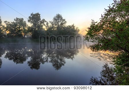 Nice sunrise over foggy river