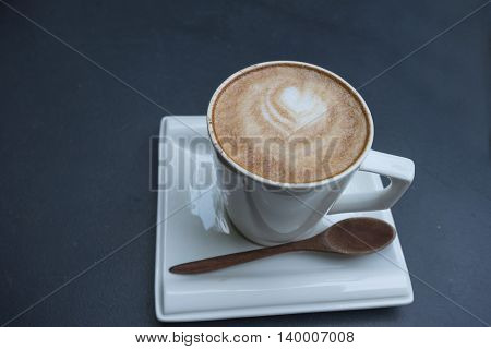 hot fresh coffee in white cup on black table and white saucer cappuccino coffee mocha coffee espresso coffee latte coffee