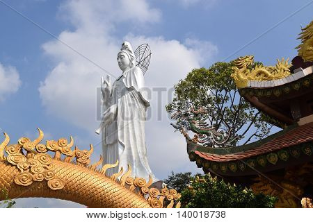 big statue of Bodhisattva at Buddhist Chau Thoi temple Binh Duong Vietnam