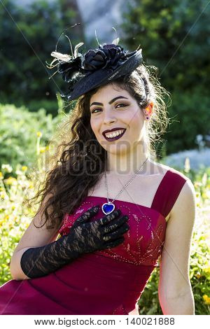 CAGLIARI, ITALY - May 29, 2016: Sunday at La Grande Jatte VIII Ed. At the Public Gardens - - portrait of a beautiful girl in Victorian costumes