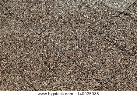 Paving stone stone background in the light of the evening sun.
