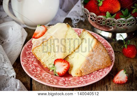 Homemade sponge cake with strawberry and cream. Delicious dessert cake with fresh berries selective focus