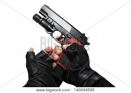 Hands in leather gloves reloading a gun clip first person view isolated photo.