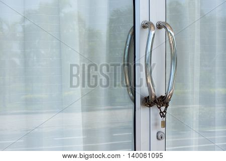 Door handles, stainless steel chain with a lock.