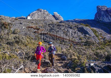 Ranau,Sabah,Borneo-March 13,2016:Group of climbers move down from Low's Peak to Laban Rata check point at Mountain Kinabalu on 13th Mac 2016.There are two summit trails,Ranau Trail & Kota Belud Trail.Climbing season officially opened on 1st December 2015 