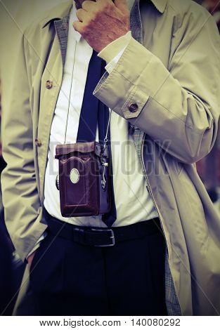 Photojournalist With Antique Camera And Retro Clothes
