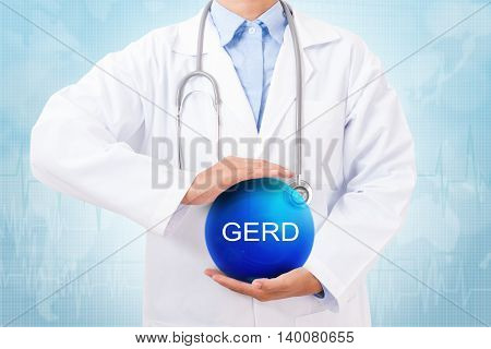 Doctor holding blue crystal ball with GERD sign on medical background.