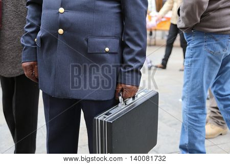 Cop With A Suitcase With Many Secret Documents