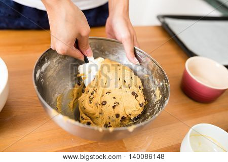 Stirring the paste in bowl