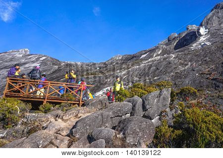 Mount Kinabalu,Ranau,Malaysia-March 13.2016:Group of climber enjoying beautiful view of the Ranau and Kundasang town from viewpoint Mountain Kinabalu.