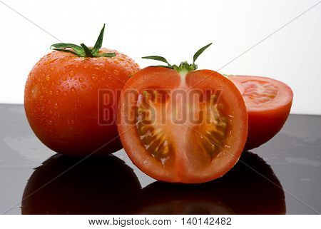 two red delicius tomato vegetable with cut