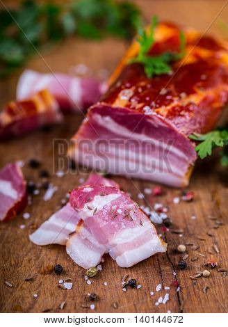 Bacon. Smoked bacon parsley herb salt pepper and garlic.Stll life studio shot.