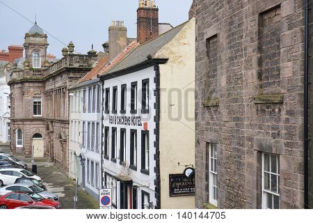 BERWICK-UPON-TWEED, UK - JULY 20: Parked cars line a street of historic buildings in the centre of the northeast England town of Berwick-upon-Tweed, Northumberland on July 20, 2015.