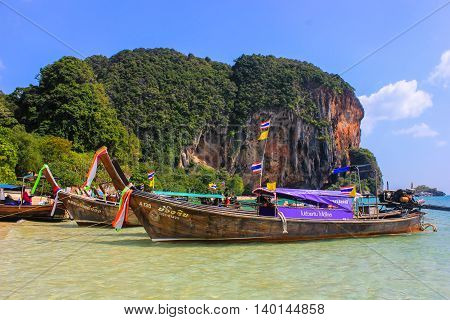 Poda island, Thailand, Asia - 30 December 2013: boats on the shore of the Andaman sea on the island of Poda