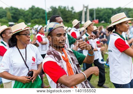 Poznan POLAND - JULY 24 2016: pilgrims praying dancing and singing during Days In Dioceses just before The World Youth Day in Krakow; WYD is a meeting of youth from all over the world