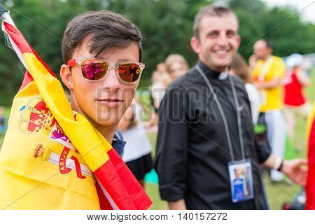 Poznan POLAND - JULY 24 2016: young Spanish pilgrim in Poznan - during Days In Dioceses just before The World Youth Day in Krakow; WYD is a meeting of youth from all over the world