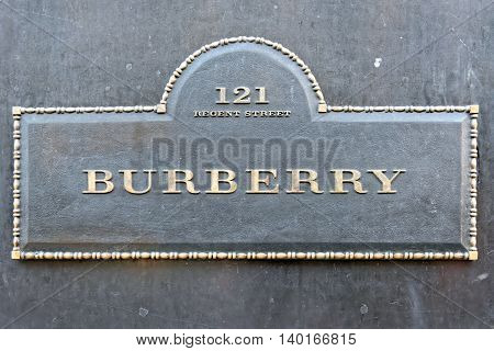LONDON UNITED KINGDOM - JULY 1 2014: Burberry flagship store sign on Regent Street London. The brand was founded by Thomas Burberry in 1856.