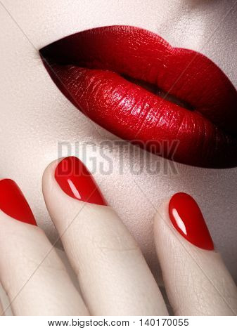 Red Sexy Lips And Nails Closeup. Open Mouth. Manicure And Makeup