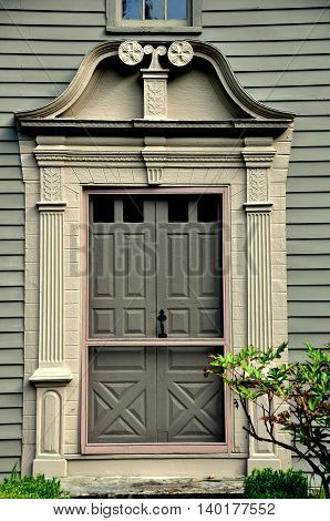 Stockbridge Massachusetts - September 16 2014: Split scroll doorway at the 1742 Mission House built by Rev. John Sergeant a minister who came to convert the Mohican Indians to Christianity