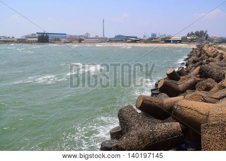 Concrete block tetrapod breakwater protect muine sea vietnam