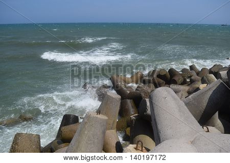 Concrete block tetrapod breakwater protect muine sea vietnam