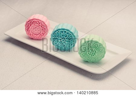 Snowy skin mooncakes. Chinese mid autumn festival foods. Traditional mooncakes on table