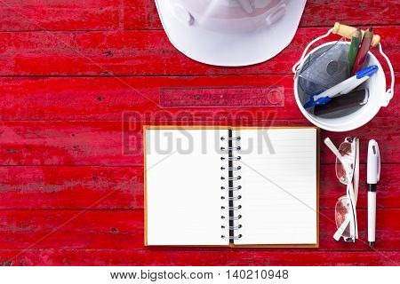 Architect tools  on wooden red table background or equipment for work daily of architect.001