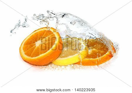 Water splash on lemon and orange slices