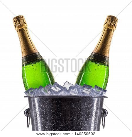 Metal champagne ice bucket with champagne isolated on a white background.