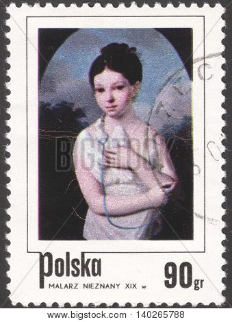 MOSCOW RUSSIA - CIRCA FEBRUARY 2016: a post stamp printed in POLAND shows a painting "Girl with dove" by an unknown artist the series "The day of the stamp: children in Polish painting" circa 1974