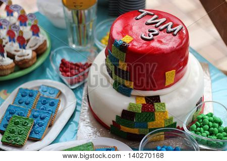 Colorful cake like toy with many different candies for 3 years old boy