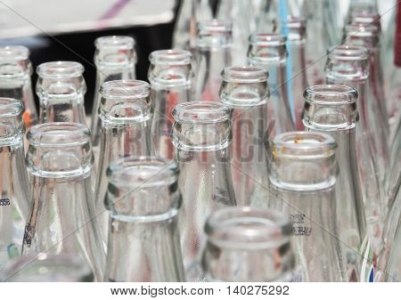 BANGKOK, THAILAND - JUNE 25: Empty recycle bottles of Coca Cola in red plastic box on June 25, 2016 in Bangkok, Thailand. Coca Cola drinks are produced and manufactured by The Coca-Cola Company