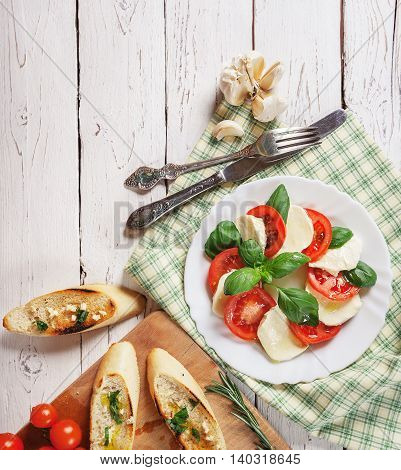 Italian salad caprese with bruschetta antipasta still life