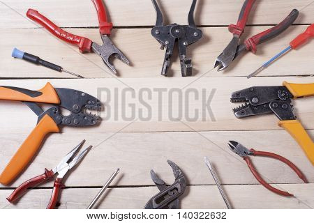 Set of electrical tool on wooden background. Accessories for engineering work, energy concept