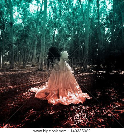 Mysterious Woman in White Dress in the Forest,Scary Woman in the Wood,Horror Background For Halloween Concept and Book Cover Ideas