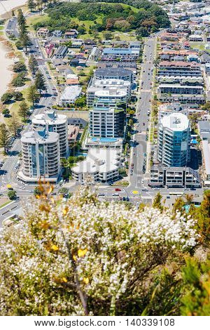 Mount Maunganui, New Zealand - November 8, 2012; Mount Maunganui from mountain summit resort area with apartment buildings dominating the landscape close to base of mountain