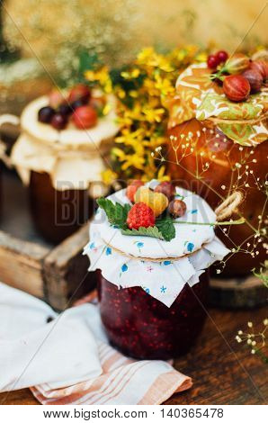 Homemade Strawberry Pits. Dessert Made Of Must And Flour Placed Inside Small Jars. Homemade Raspberr